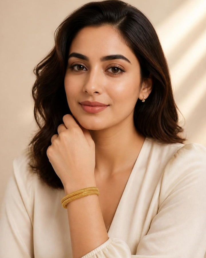 Woman wearing Sanskriti Woven Gold Bangles, front view