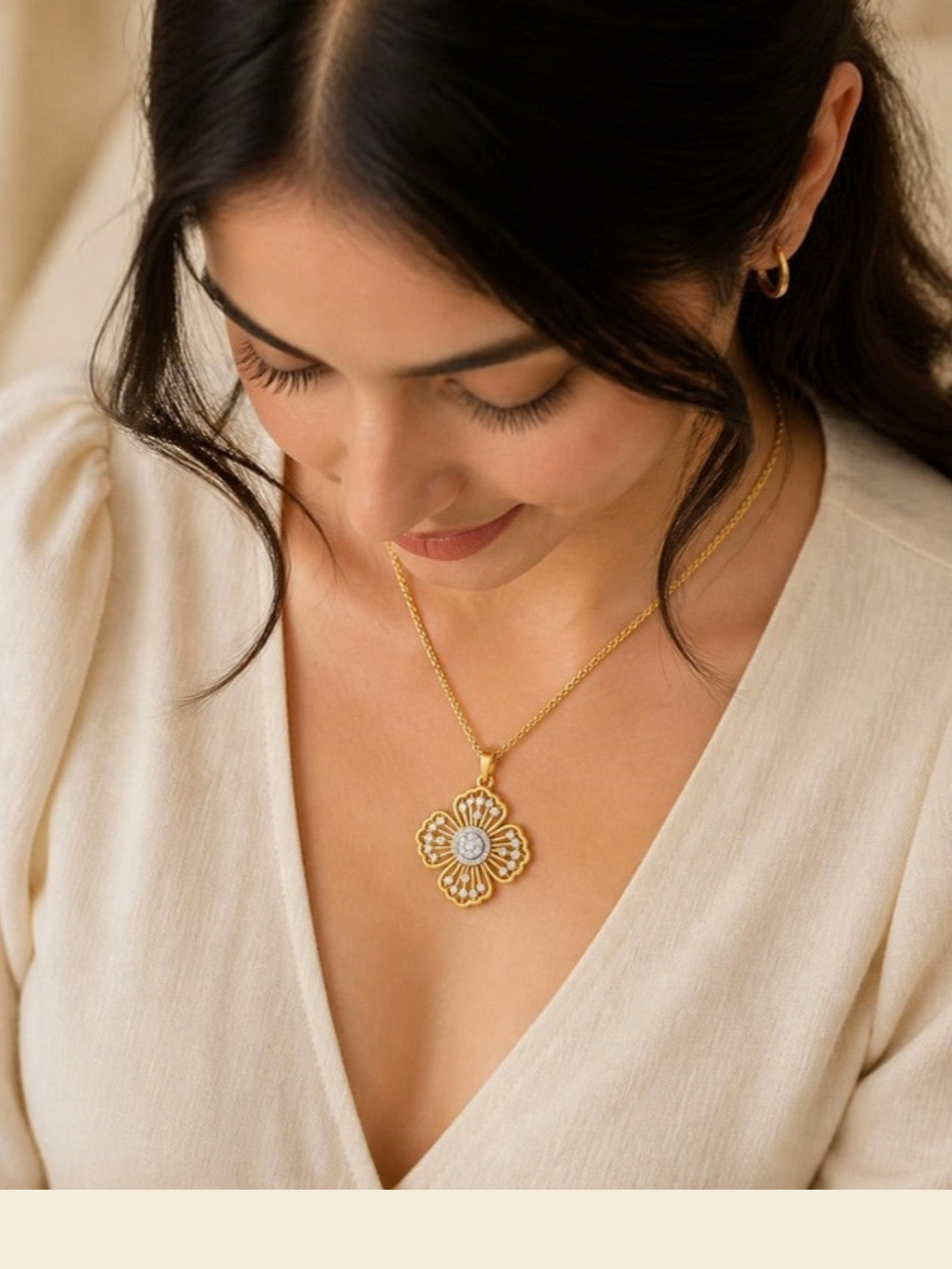 Woman wearing Blossom Radiance Gold Pendant, top-down view