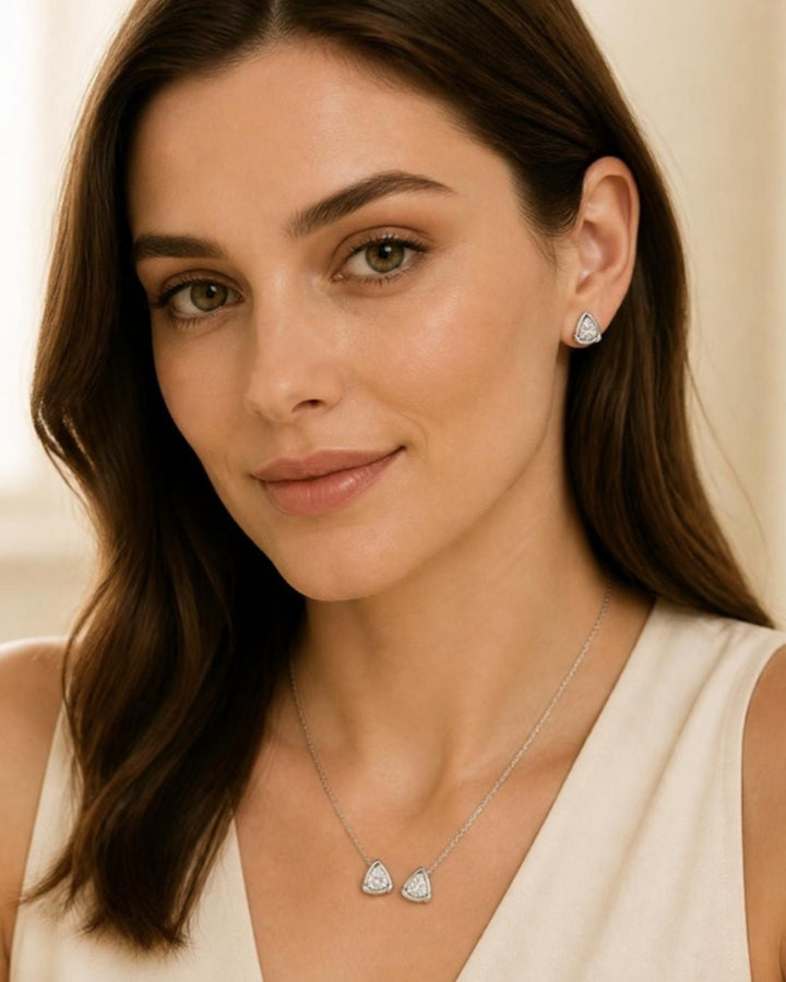 Woman wearing Trinity Ice Stud Earrings, front view