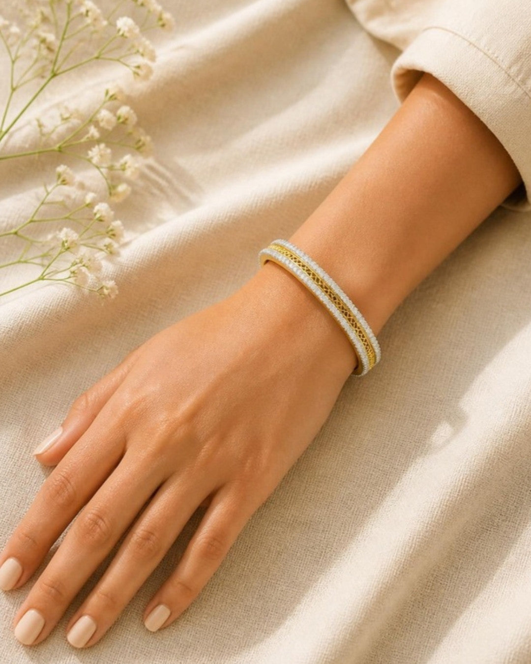 Woman wearing Sanskriti Regal Diamond-Trimmed Gold Bracelet, top-down view
