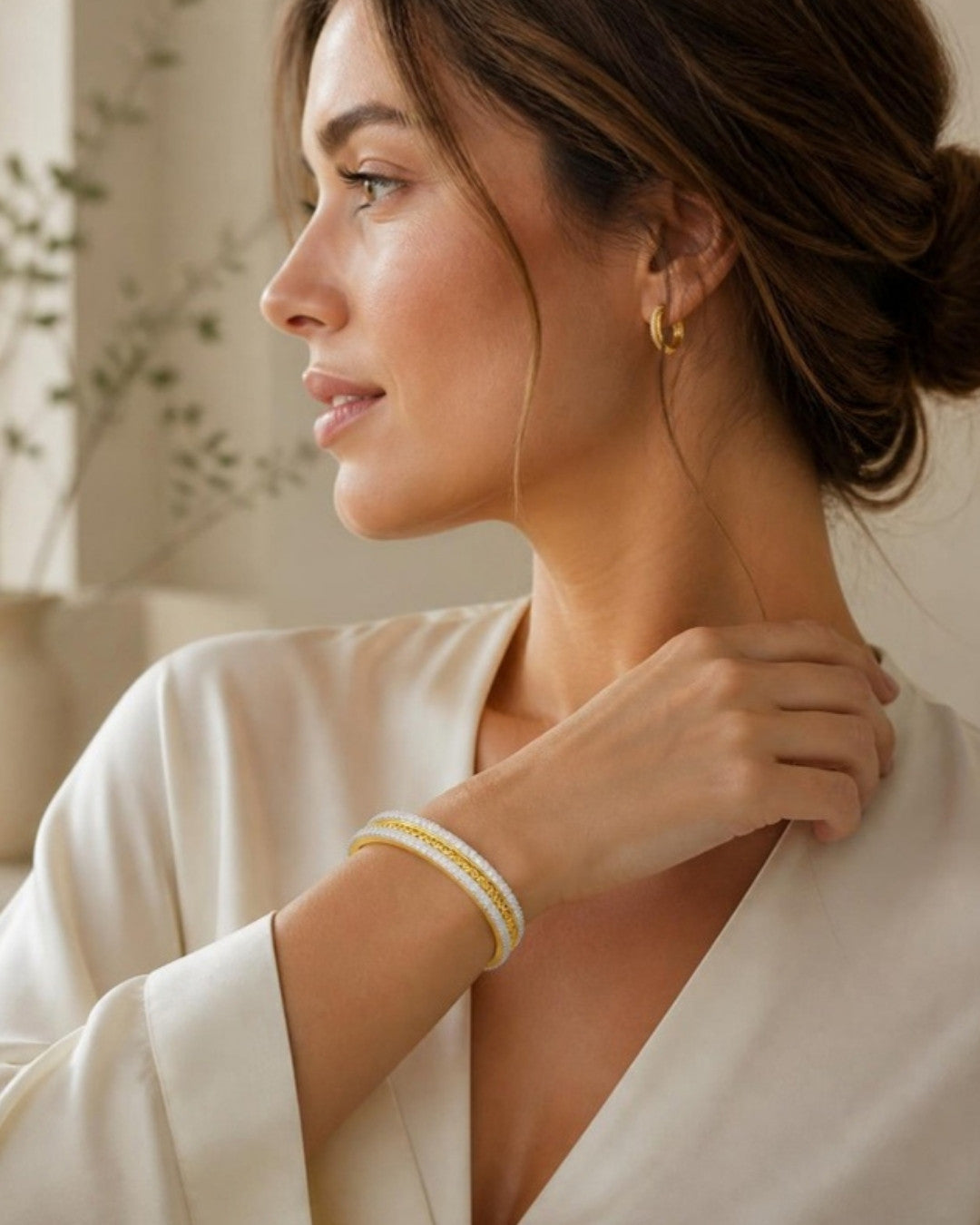 Woman wearing Sanskriti Regal Diamond-Trimmed Gold Bracelet, side profile view