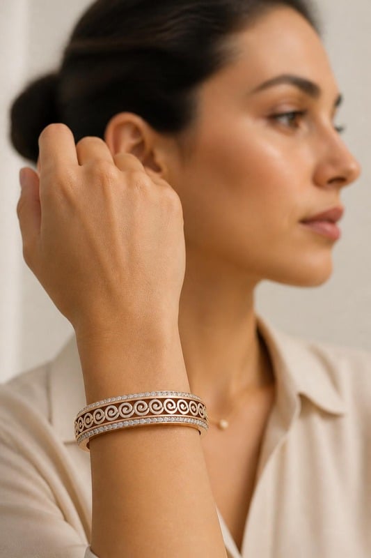 Elysian Swirl Diamond Bangle worn by a model, side view