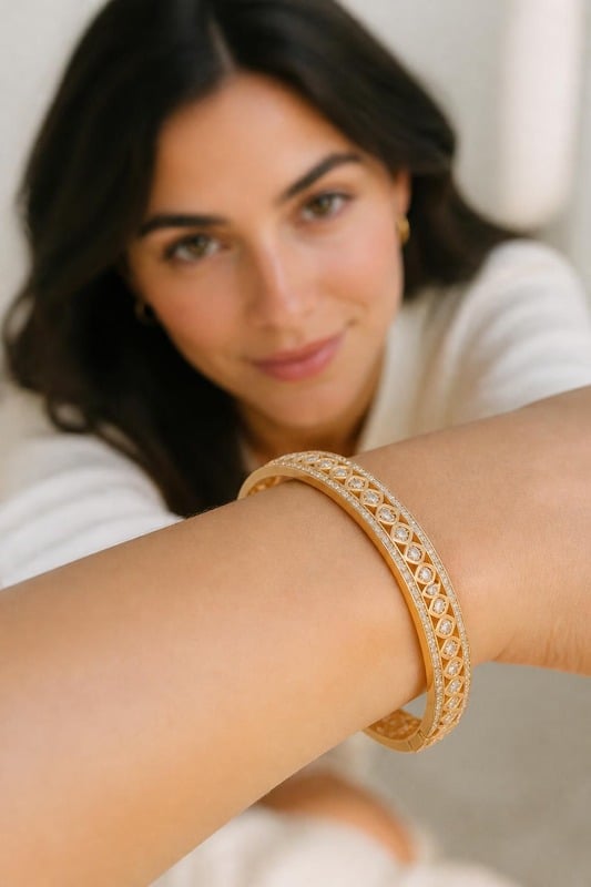 Regal Bloom Diamond Bangle worn by a model, top-down view
