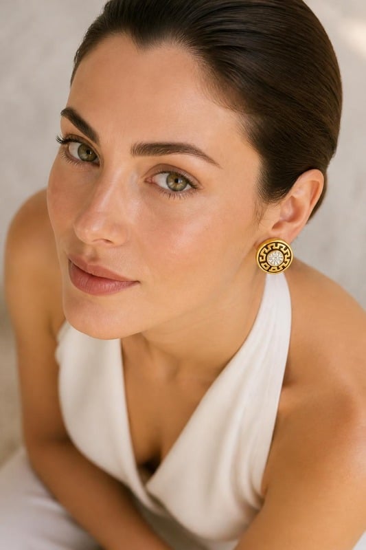 Regal Maze Stud Earrings worn by a model, top-down view